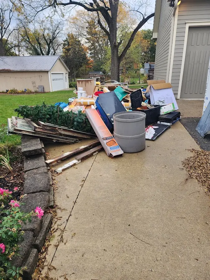 Dumpster being loaded with debris for Residential Dumpster Rental in St. Augusta